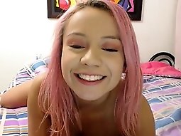 Pink haired cutie with a marvelous ass fingers her snatch o