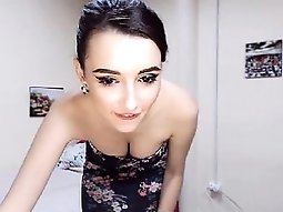 Exotic teen brunette slides down her tiny black dress to fl